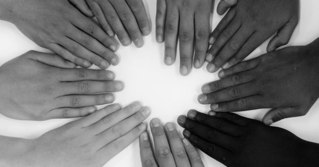 Volunteering, voluntouring, volunteering hands, world peace, hands, united, united nations, colours, circle of hands, black and white